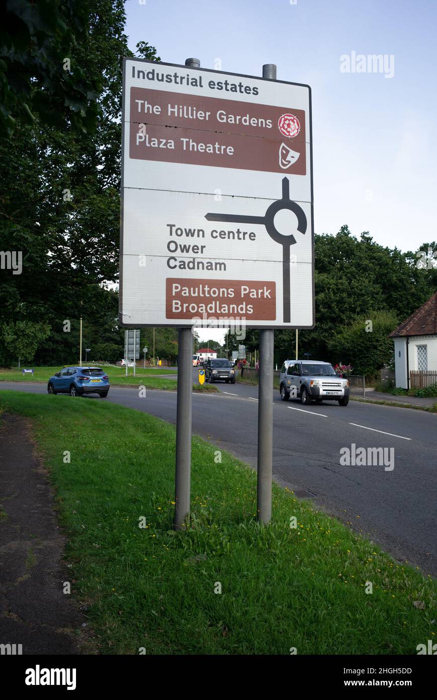 Road sign leading onto the Main roundabout in the market town of Romsey Hampshire giving directions to surrounding areas including Paultons Park. Stock Photo