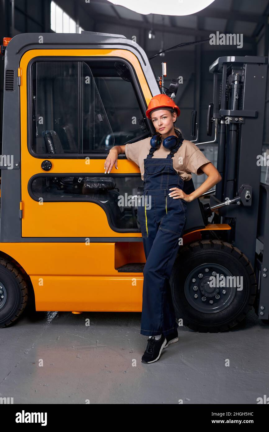 Woman standing next to forklift hires stock photography and images Alamy