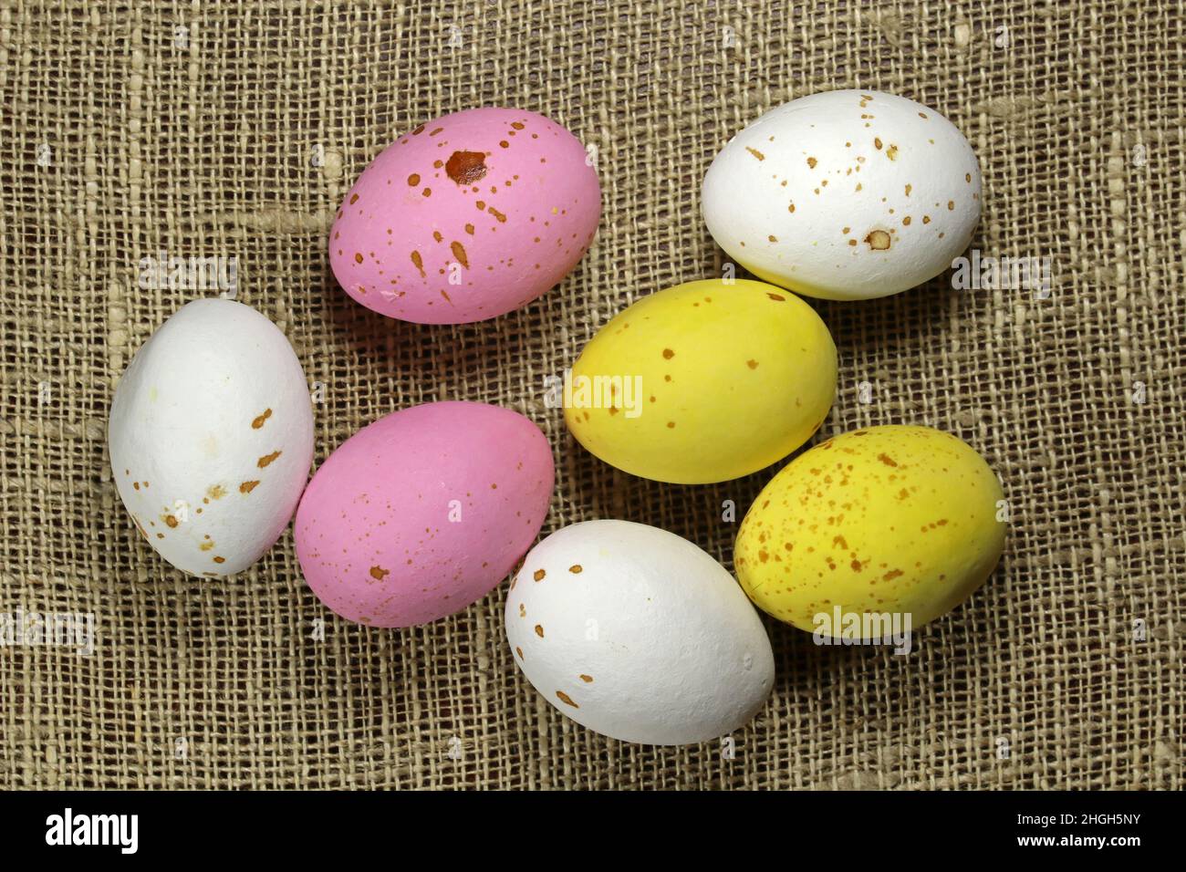 Multicolored Easter eggs on the linen fabric . Stock Photo