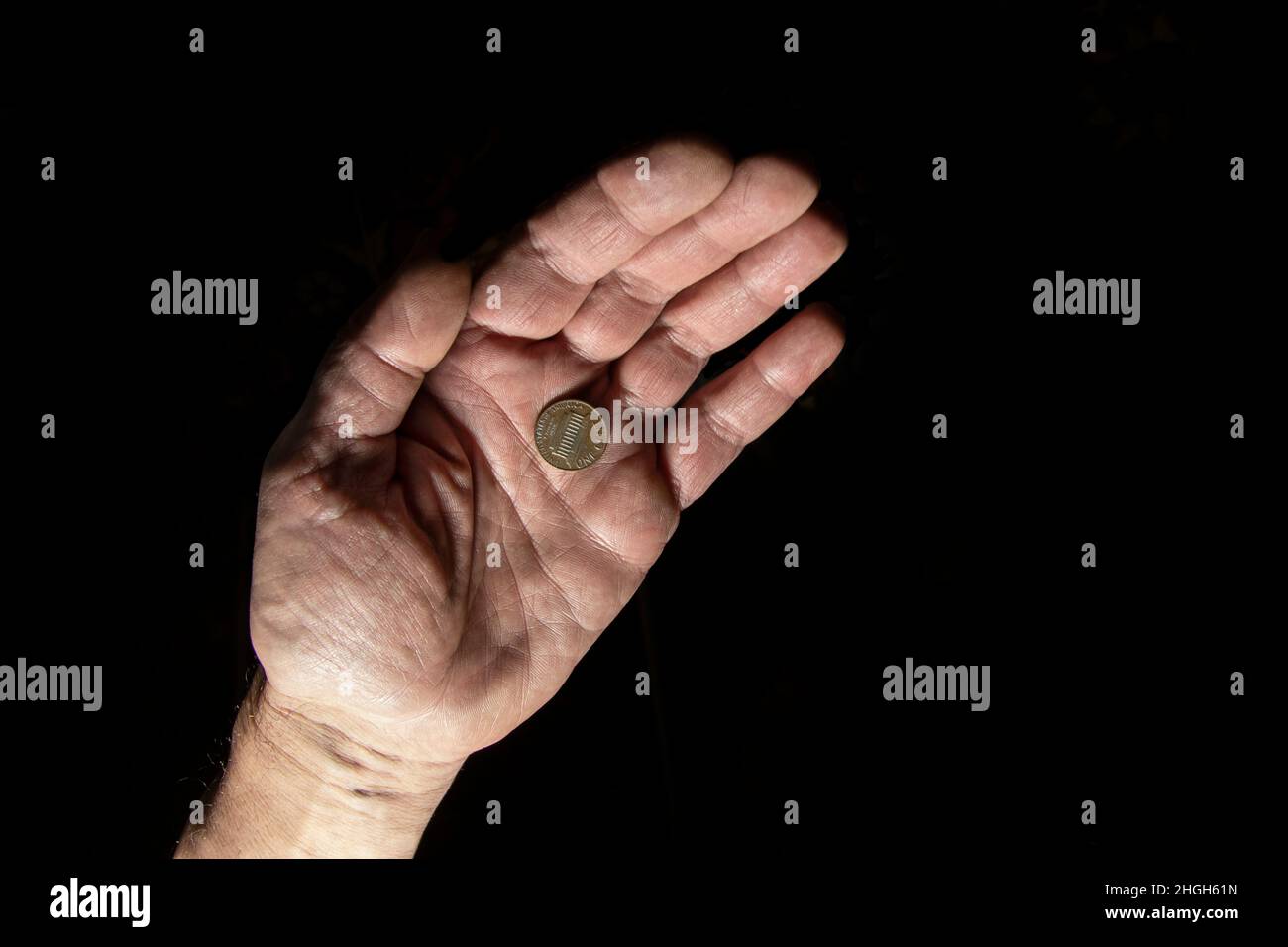 Human Hand Coin Coin holding human hand fingers hi-res stock photography and images - Alamy