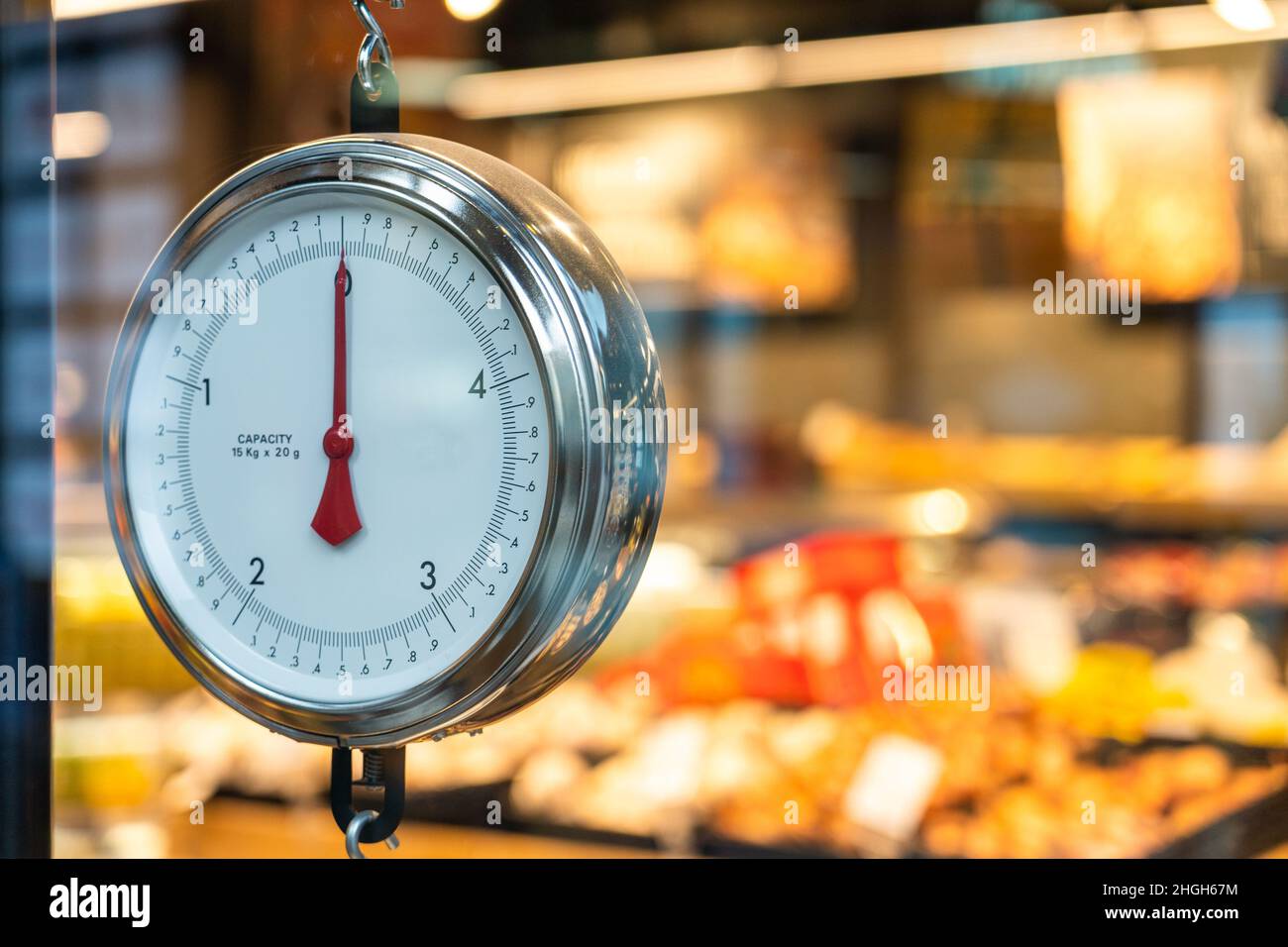 Round weight scales at the supermarket vegetables department Stock