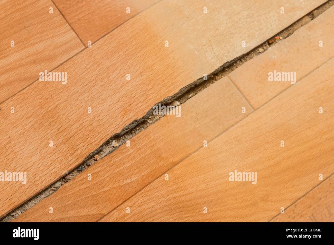 Broken torn linoleum old rubber polymer PVC floor damage material