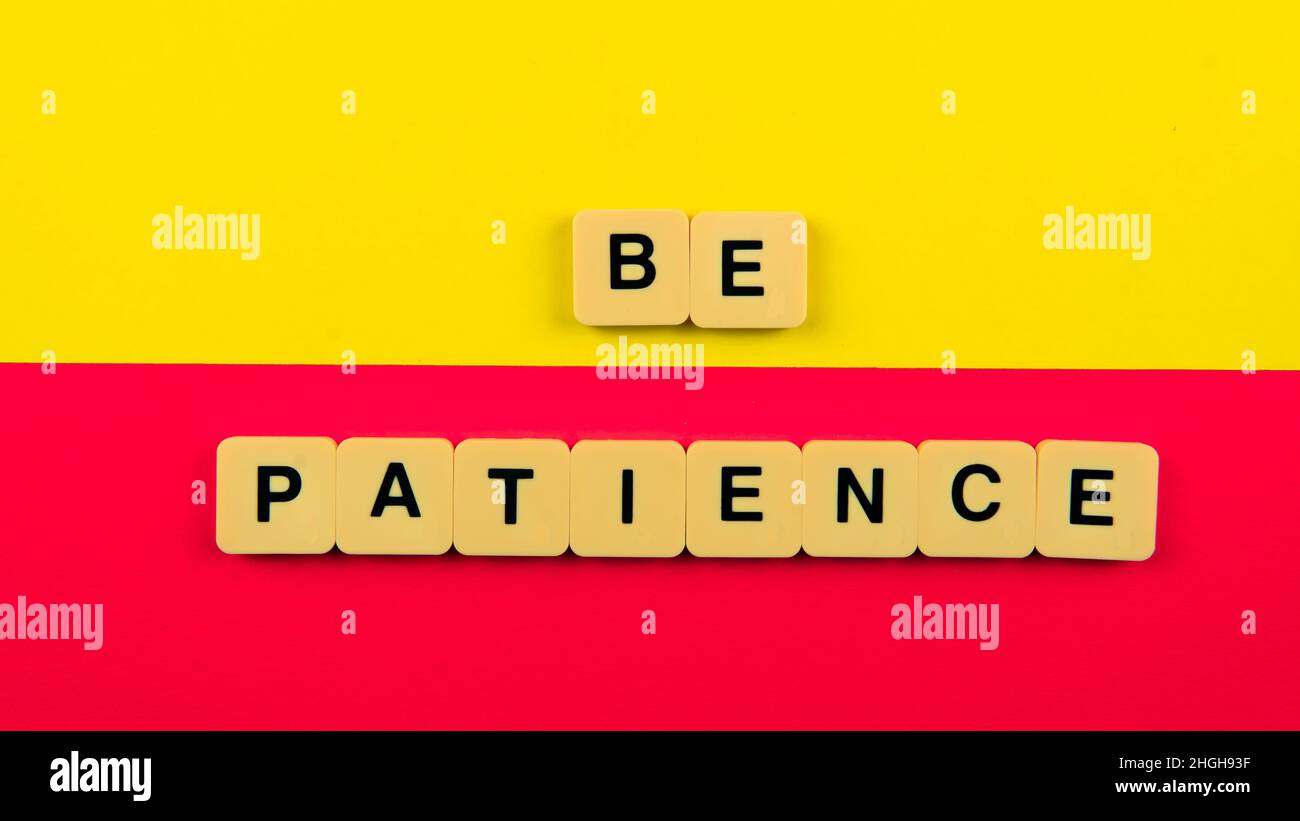 A selective focus on a tile that motivate people to be patience. Stock Photo