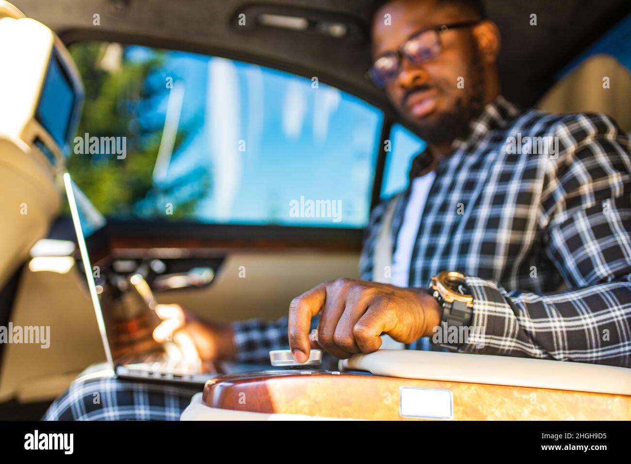 Close Businessman Hand Tuning Air Ventilation Grille While Driving