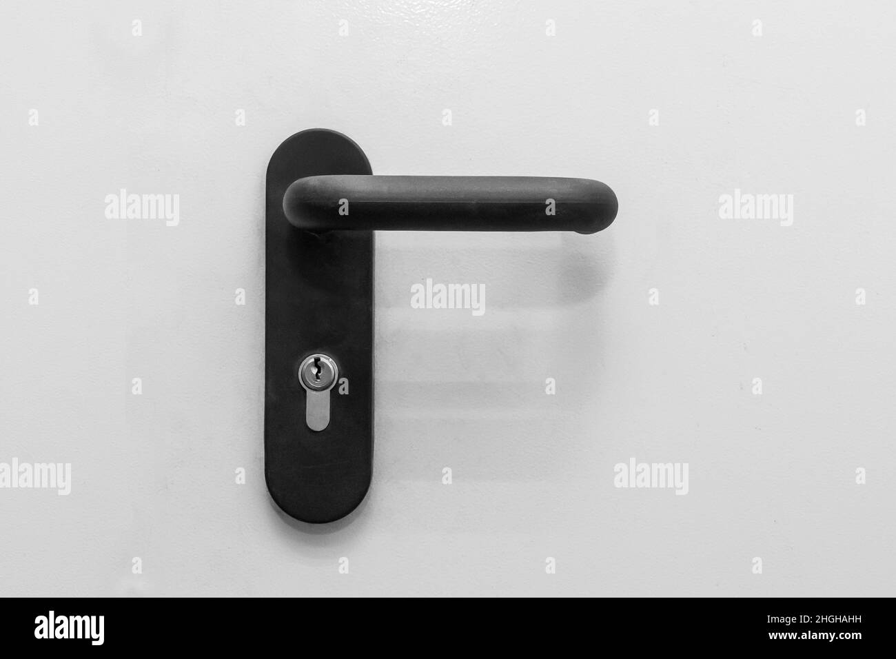 Steel doorknob opening or closing the entrance or exit of the house, close-up. Stock Photo
