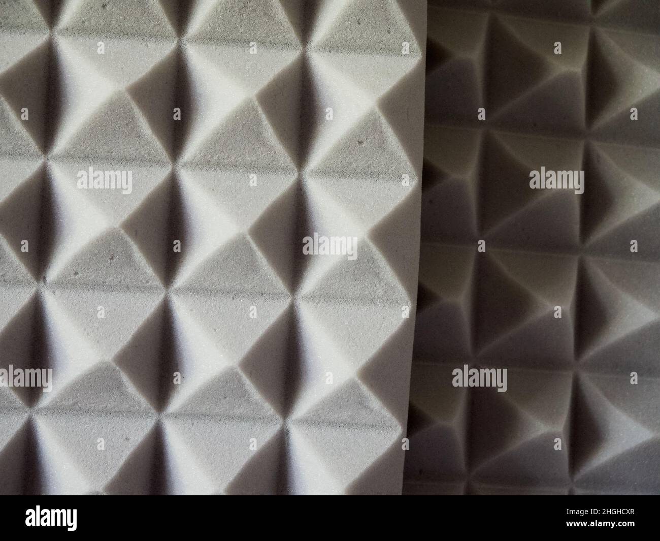 Plates of gray soundproof foam rubber. Sound-absorbing material. Stock Photo