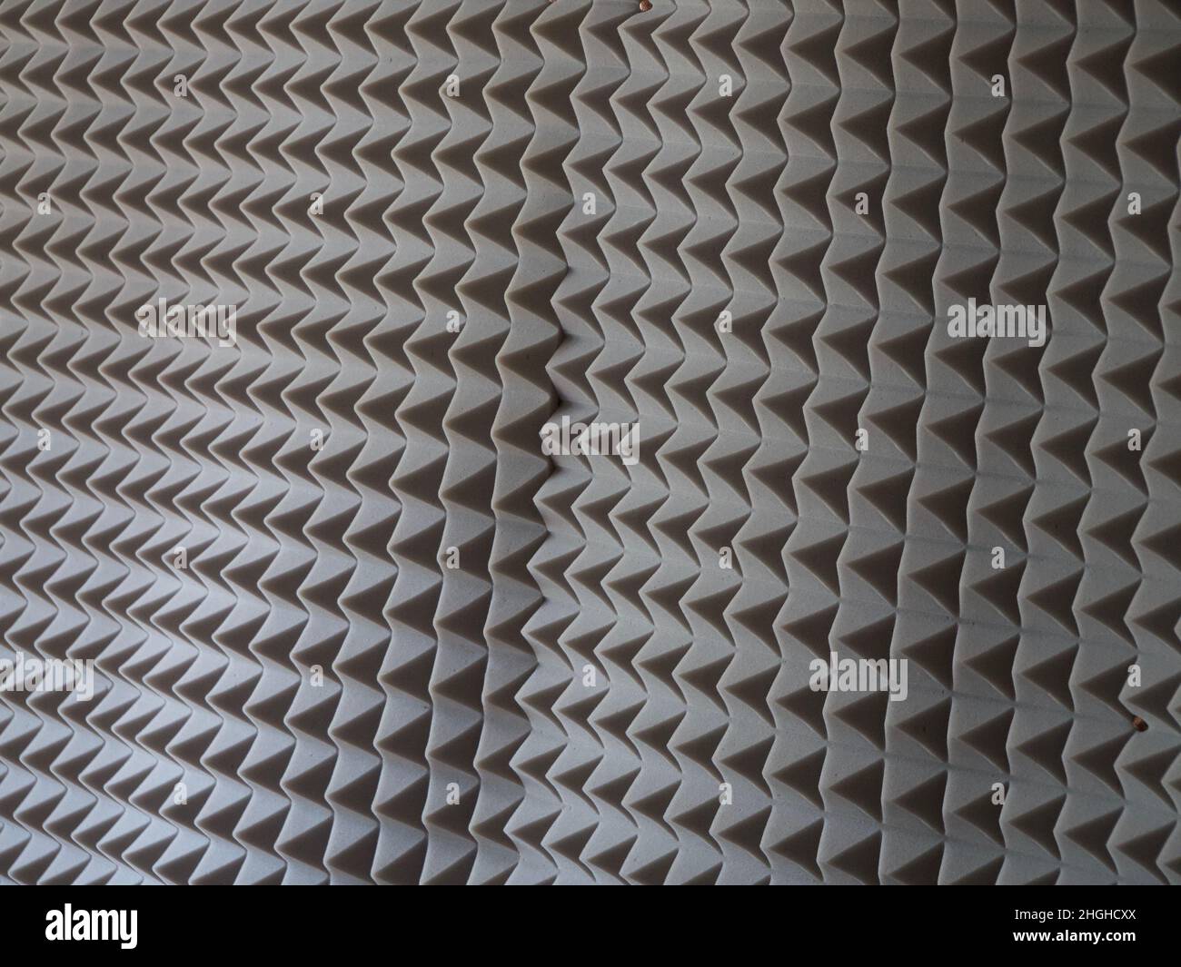 Grey acoustic foam rubber. Soundproof pyramids, full frame Stock Photo
