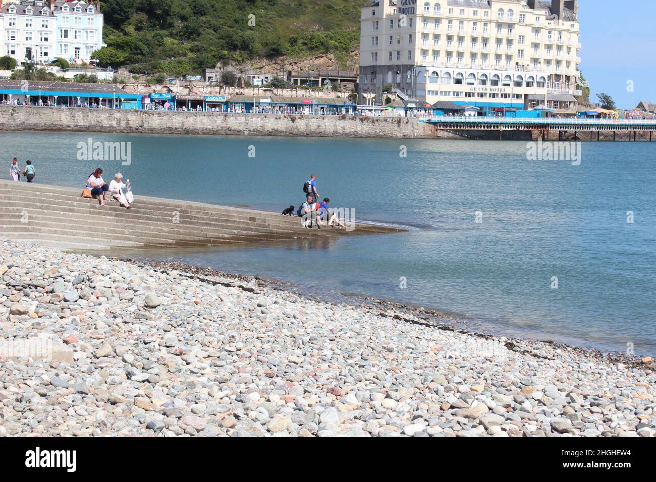 Llandudno is a coastal town in North Wales. Its known for its north shore beach and 19th century pier with shops and fun rides Stock Photo