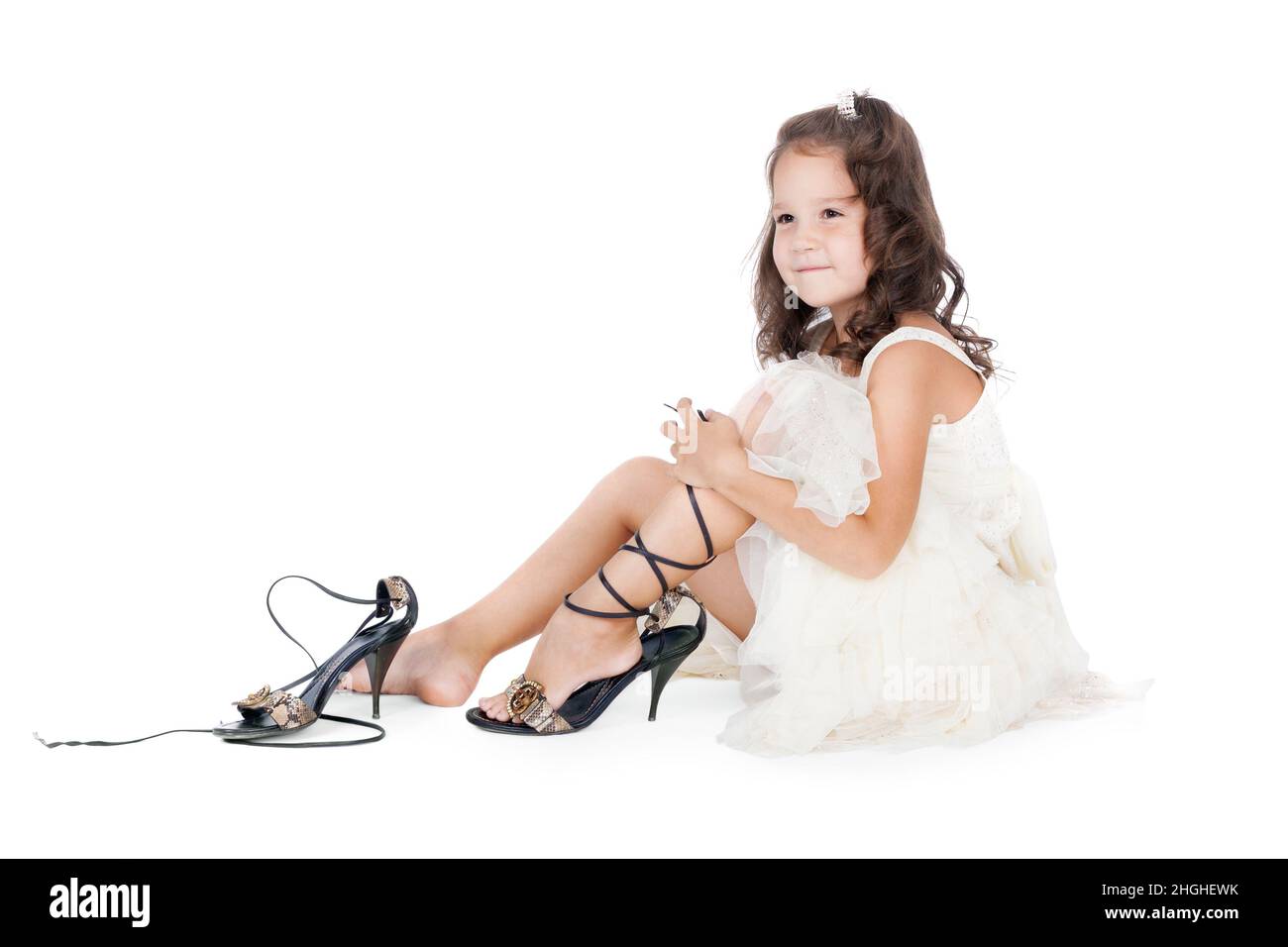Little girl on high heels hi-res stock photography and images - Alamy