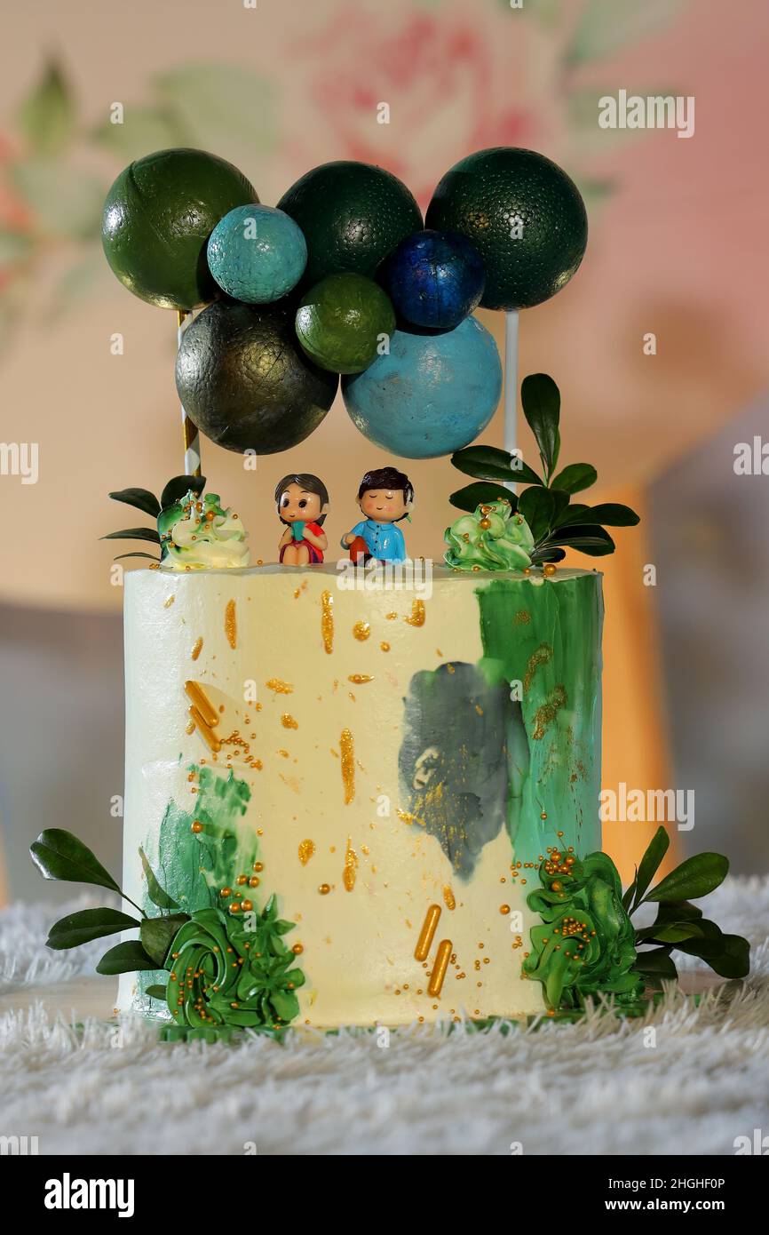 Birthday cake arrangement on table Stock Photo