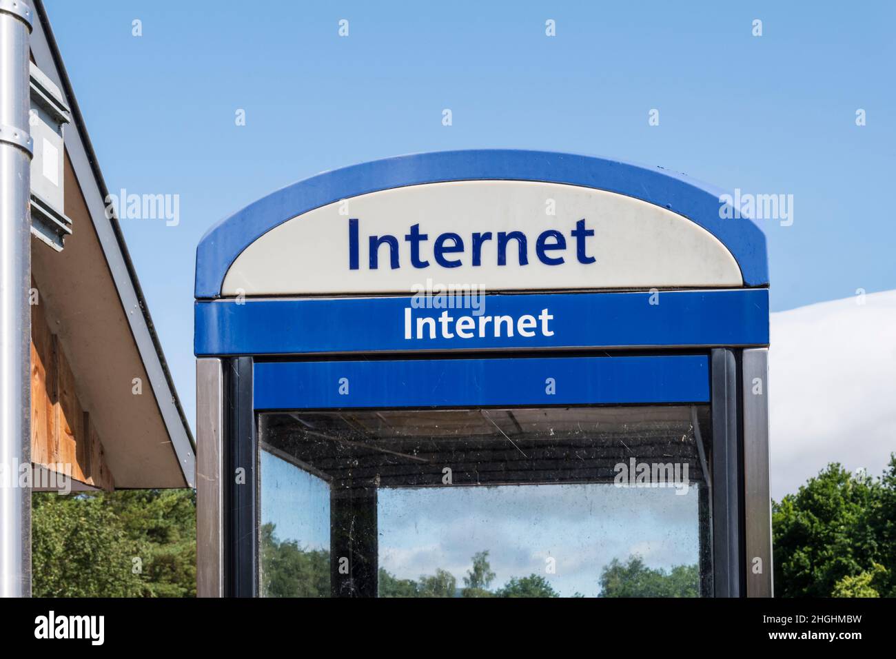Internet sign on a telephone kiosk. Stock Photo