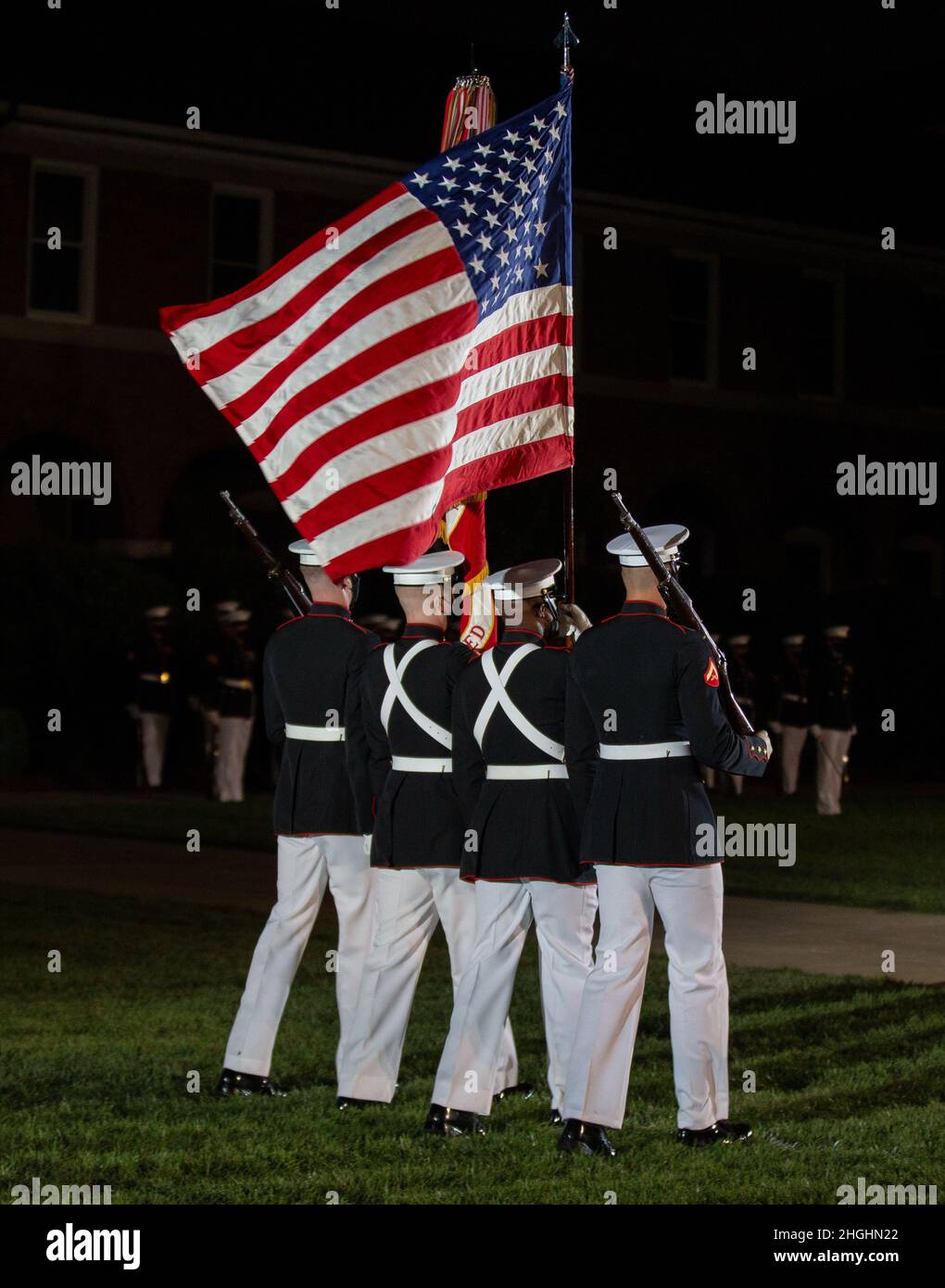 Marines with the Official Marine Corps Color Guard march across the parade deck during a Friday Evening Parade at Marine Barracks Washington, Aug. 6, 2021. The guests of honor for the evening were Chief Warrant Officer 4 Hershel W. “Woody” Williams, World War II Medal of Honor Recipient, Col. Harvey C. “Barney” Barnum, Vietnam War Medal of Honor Recipient, and Cpl. William K. “Kyle” Carpenter, Global War on Terrorism (Afghanistan) Medal of Honor Recipient, and the hosting officials were the 38th Commandant of the Marine Corps, Gen. David H. Berger, and the 19th Sergeant Major of the Marine Cor Stock Photo