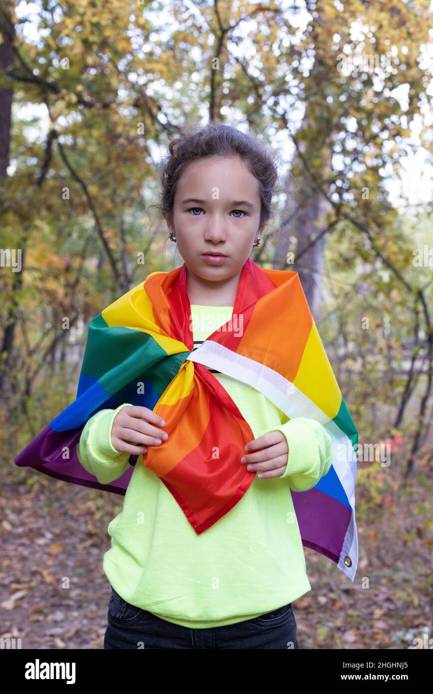 Portrait of little girl with rainbow flag. lgbtq concept Stock Photo