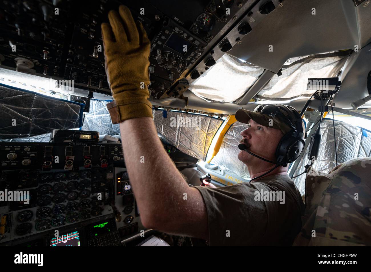 A U.S. Air Force KC-135R Stratotanker aircraft pilot, assigned to the 340th Expeditionary Air Refueling Squadron, works though his preflight checklist prior to an operation supporting Operation Freedom’s Sentinel at Al Udeid Air Base, Qatar, Aug. 6, 2021. The 340th EARS, deployed with U.S. Air Forces Central, is responsible for delivering fuel to U.S. and partner nations, enabling airpower, deterrence, and stability in the region. Stock Photo