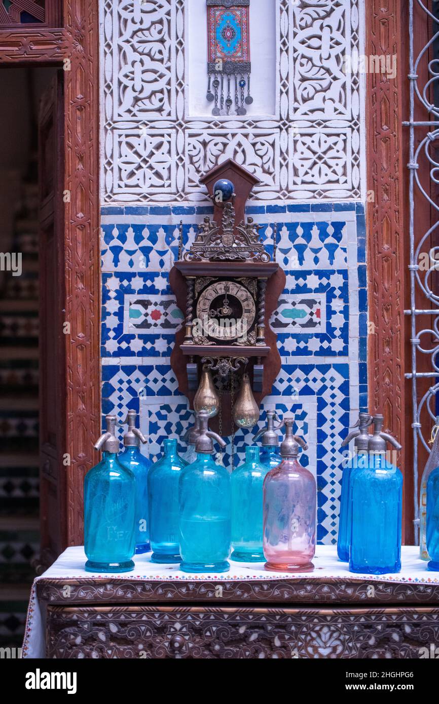 Interior close-up in a riad in Marrakesh Morocco with a clock, blue ...