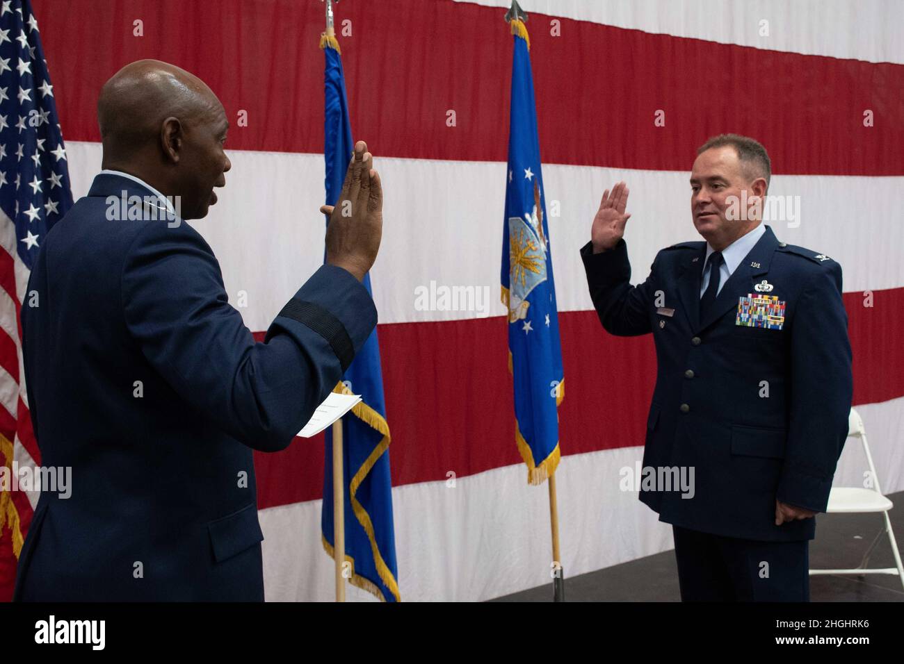 Col. Brian Gunderson reaffirms his oath to the Constitution of the United States during his promotion ceremony at the Nevada Air National Guard Base in Reno, Nev., Aug. 7, 2021. Stock Photo