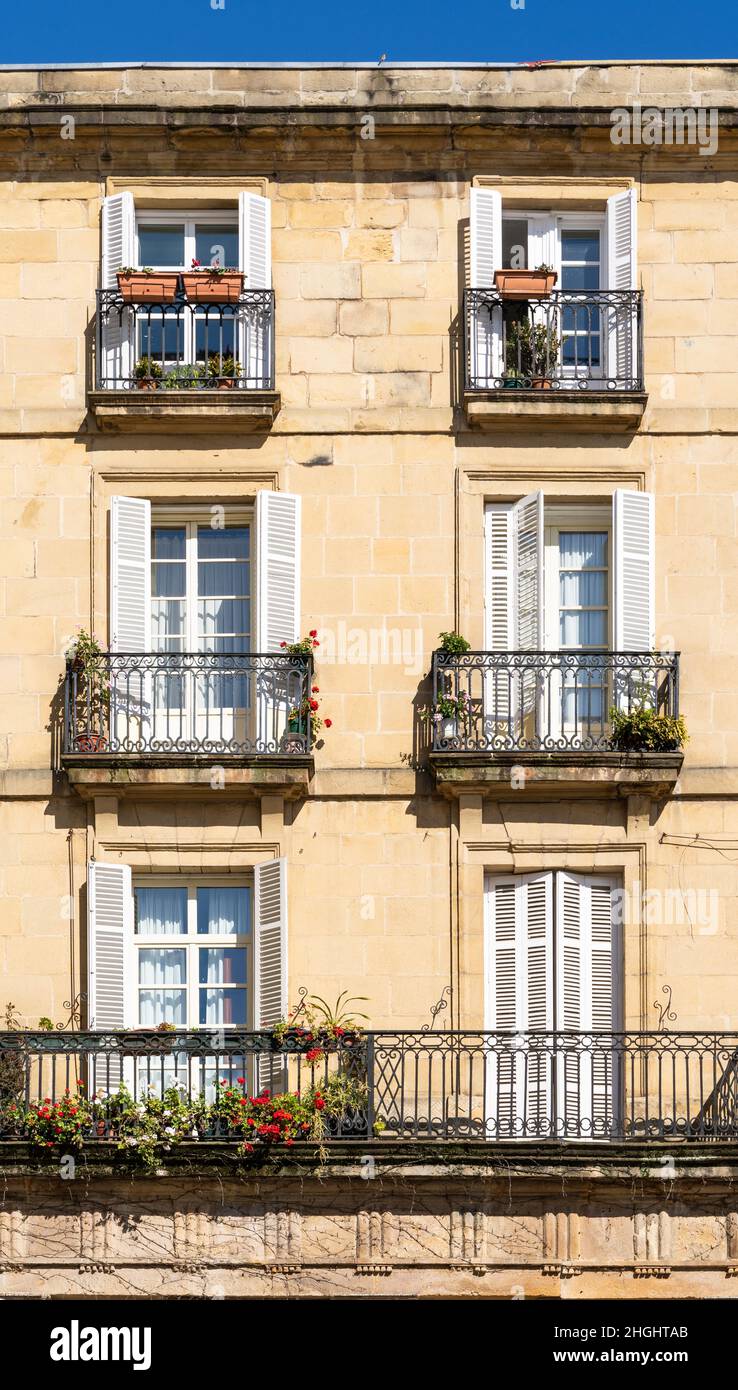 Sunlight on facade of classic building in Bilbao old town street ...