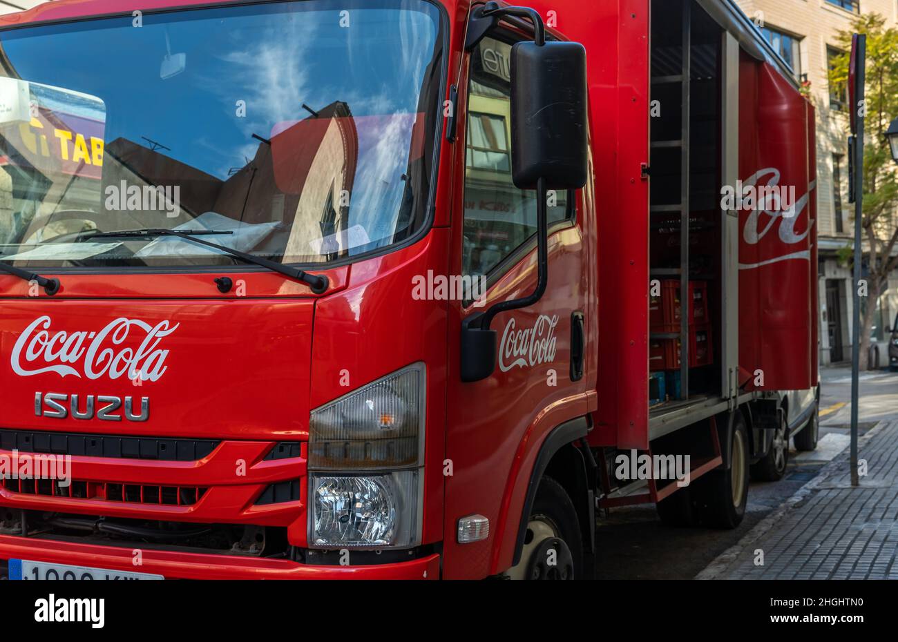 Campos, Spain; january 20 2022: Delivery truck of the Coca Cola beverage company, parked in the historic center of the Mallorcan town of Manacor Stock Photo