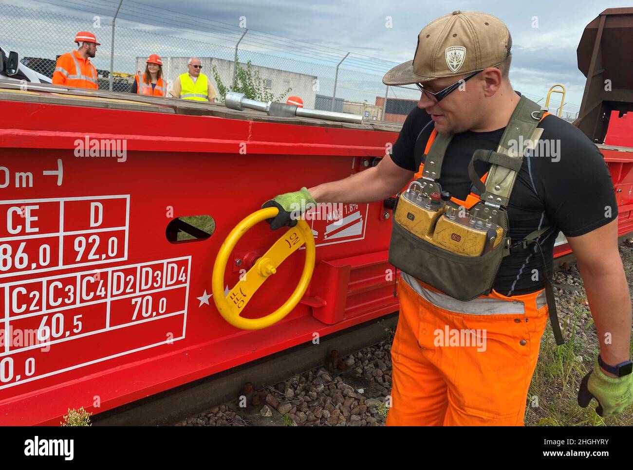 Juerg Lischewski, a cargo train driver with Deutsche Bahn, locks the brakes on a newly