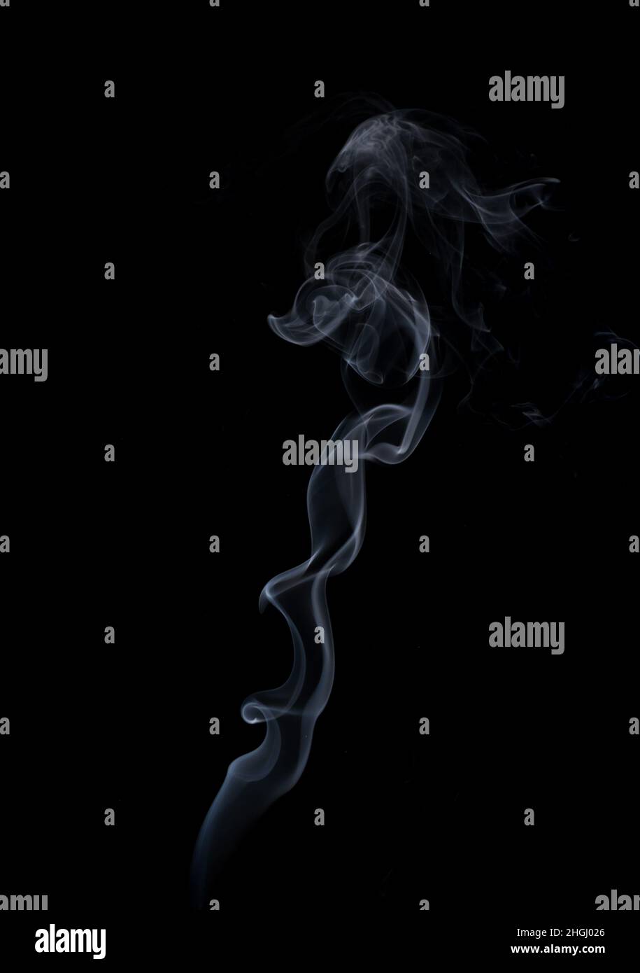 Abstract white smoke shape over black. Isolated. Stock Photo