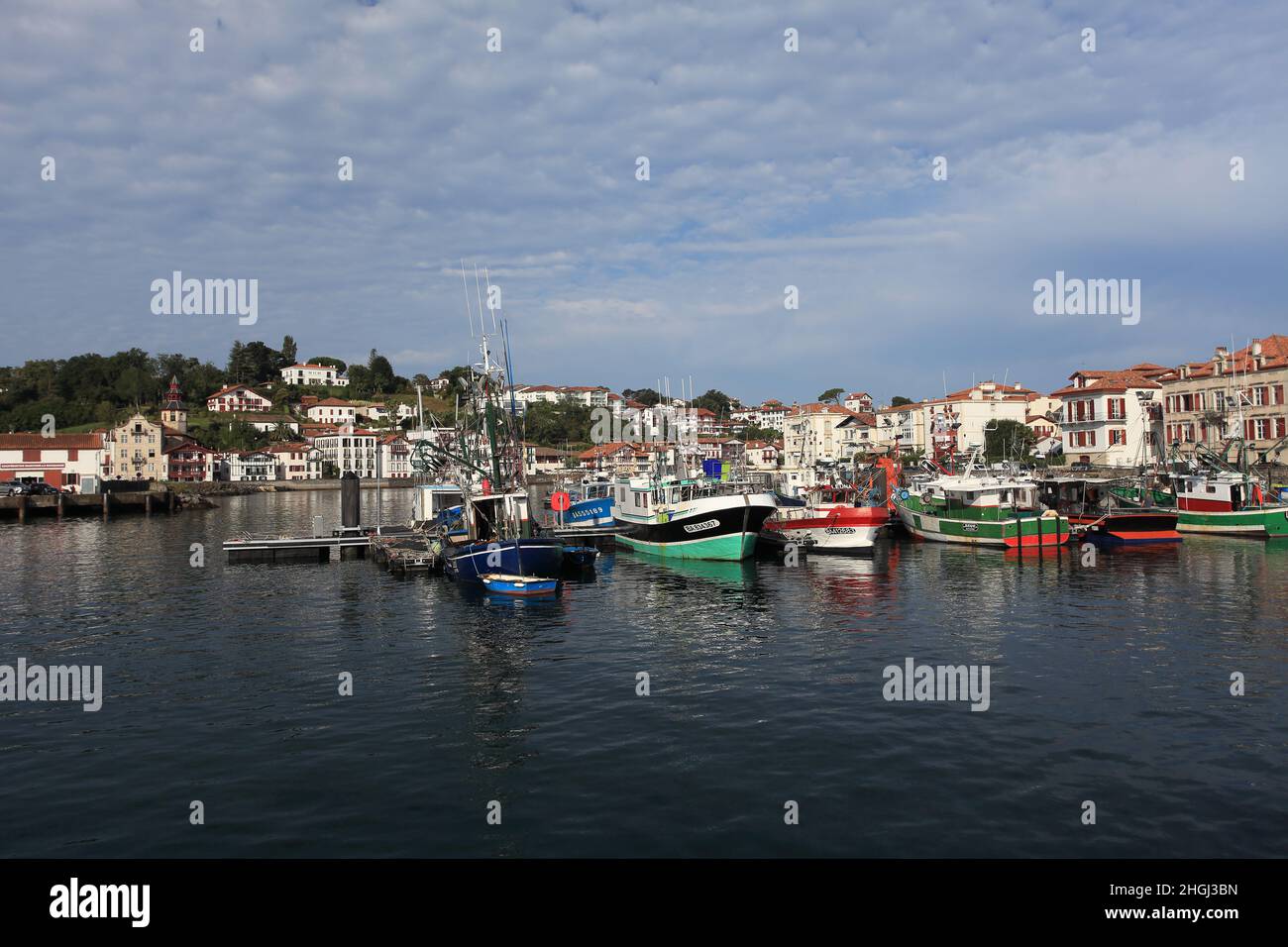 The picturesque fishing harbour of St Jean de Luz with Ciboure in the background, France, Pays Basque, Nouvelle Aquitaine Stock Photo