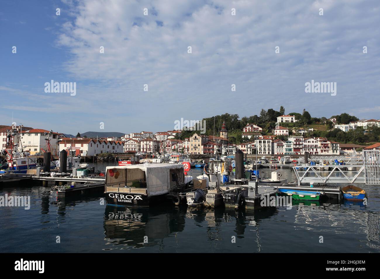 The picturesque fishing harbour of St Jean de Luz with Ciboure in the background, France, Pays Basque, Nouvelle Aquitaine Stock Photo