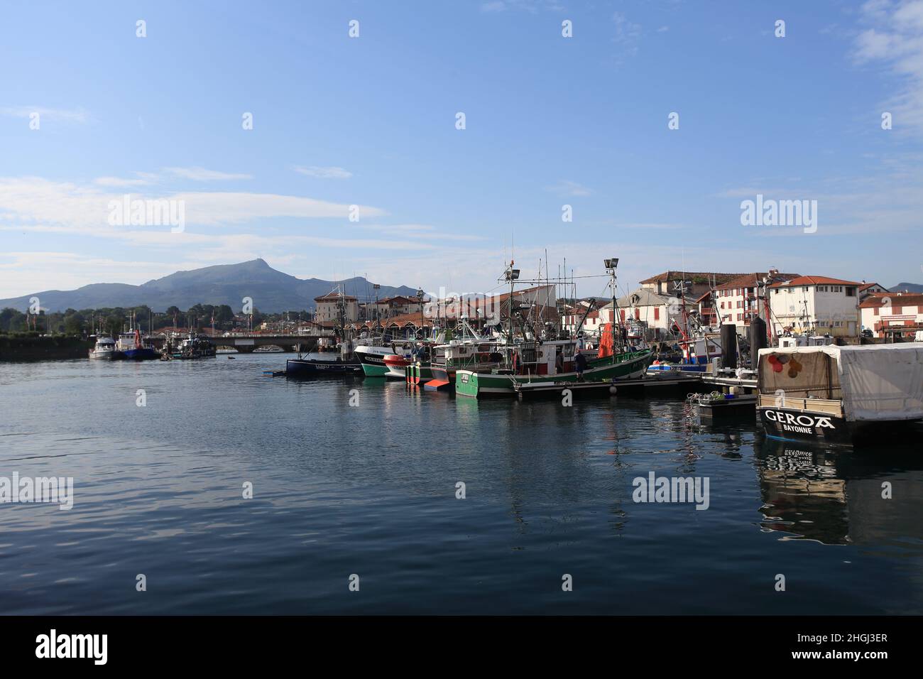 St Jean de Luz harbour at the mouth of the river Nivelle, with a clear view of La Rhune mountain in the background, France, Pays Basque. Stock Photo