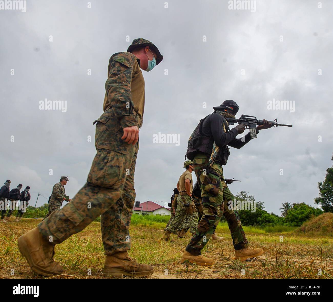 A U.S. Marine with Combined Task Force-68 observes a member of the ...