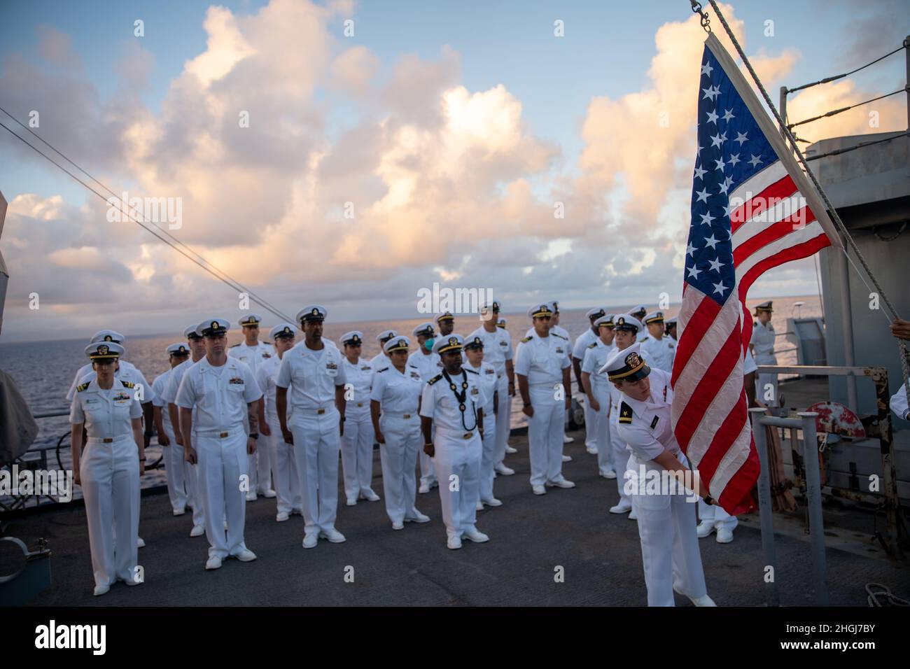PACIFIC OCEAN (Aug. 13, 2021) U.S. Sailors assigned to amphibious dock landing ship USS Pearl Harbor (LSD 52), stand in formation during a memorial service honoring Chief Electrician’s Mate Stuart Hedley aboard Pearl Harbor, Aug. 13. Hedley served in the U.S. Navy for over twenty years and survived attack at Pearl Harbor, Hawaii, Dec. 7, 1941. Marines and Sailors of the 11th Marine Expeditionary Unit (MEU) and Essex Amphibious Ready Group (ARG) are underway conducting routine operations. Stock Photo