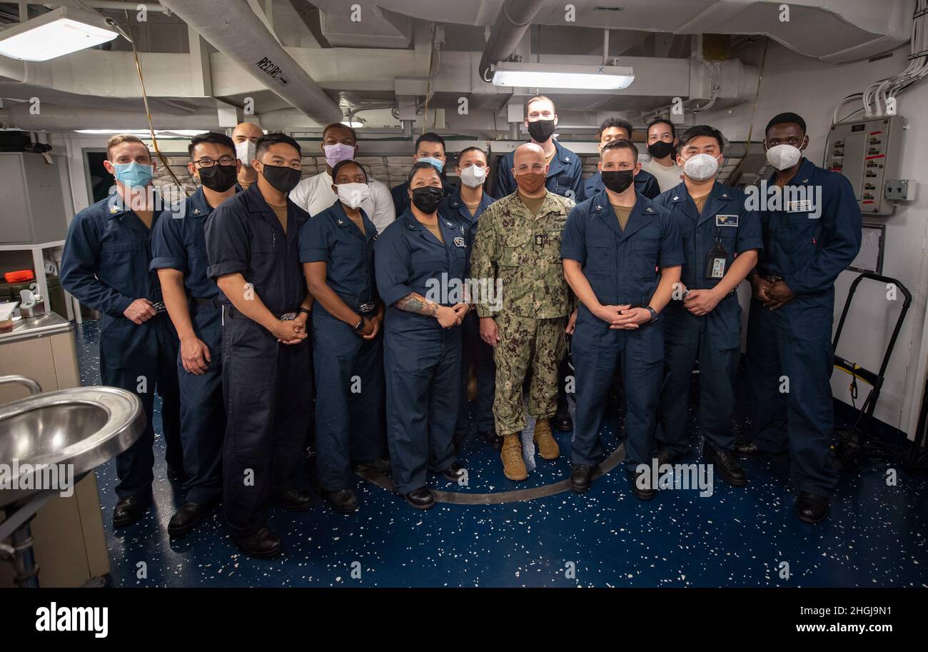 PACIFIC OCEAN (August 14, 2021) Master Chief Petty Officer of the Navy  Russell Smith poses for a photo with the medical department aboard USS Carl  Vinson (CVN 70) during Large Scale Exercise