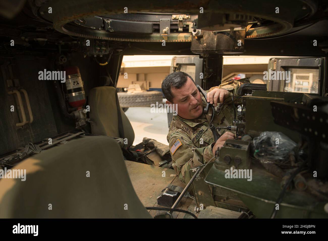 Idaho Army National Guard Sgt. Keith Olson tests the communications in ...