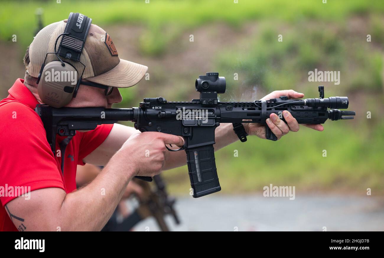 U.S. Marine Corps reservist Cpl. Jake Stotts, scout sniper, 2nd Battalion, 24th Marine Regiment, a Pierre, South Dakota native, fires his custom AR15 on Marine Corps Base Quantico, Virginia, Aug. 17, 2021.  For the first time; the Marine Corps Reserve Shooting team trained with the Marine Corps Shooting Team in order to sharpen up their skills for upcoming shooting matches. Stock Photo