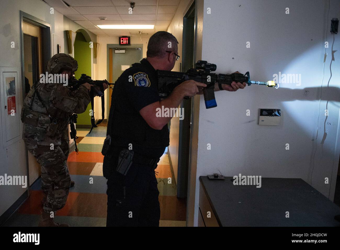 Members of the 88th Security Forces Squadron work to clear a building ...