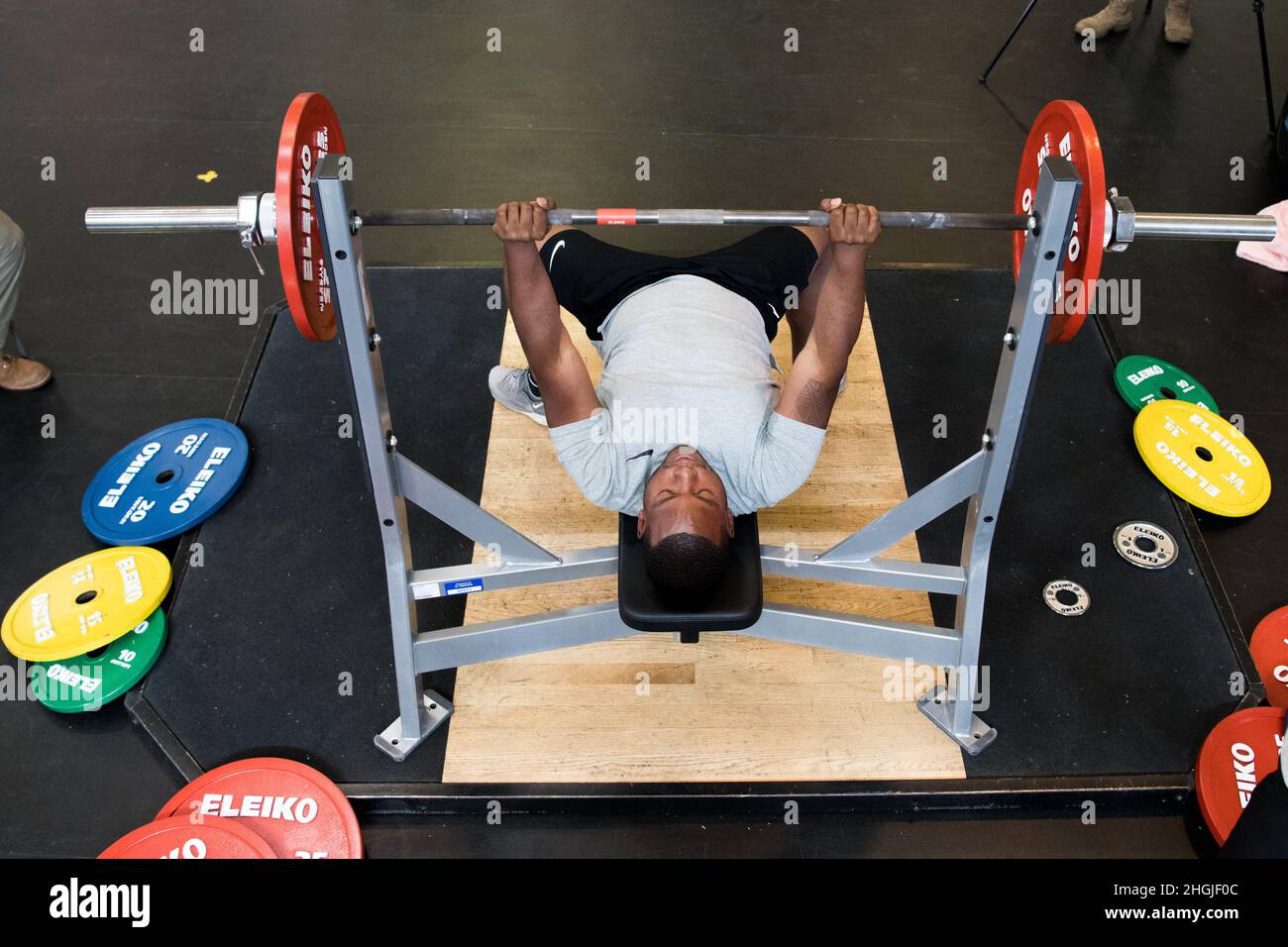 Brian Genestan, power lifting competitor, completes a bench press at ...