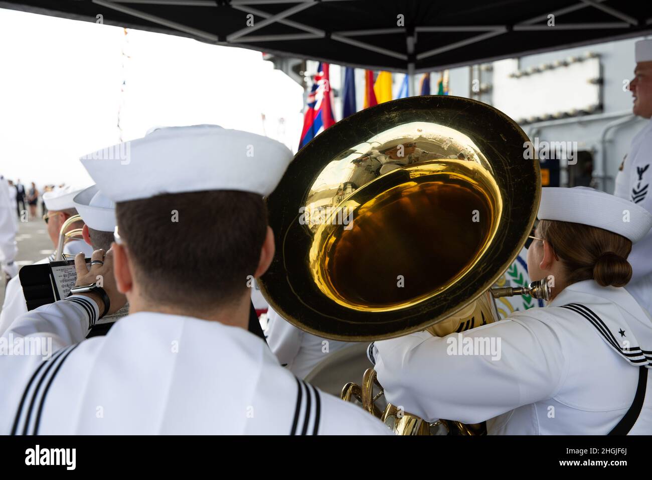 SAN DIEGO (Aug. 19, 2021) Sailors assigned to the Navy Band Commander, Navy Region Southwest, prepare to play music during a change of command ceremony aboard the aircraft carrier USS Abraham Lincoln (CVN 72). Capt. Walt “Sarge” Slaughter successfully completed his 26 month tour as commanding officer during which Abraham Lincoln completed a 10-month combat deployment, the largest carrier work package ever completed in San Diego, and returned to sea in preparation for an upcoming deployment amidst the COVID-19 pandemic. Slaughter was relieved by Capt. Amy Bauernschmidt. Stock Photo