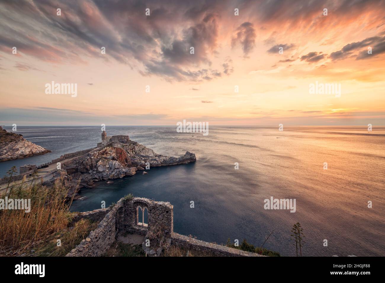 Wonderful sunset full of colors in Porto Venere - Italy in front of the church overlooking the sea Stock Photo