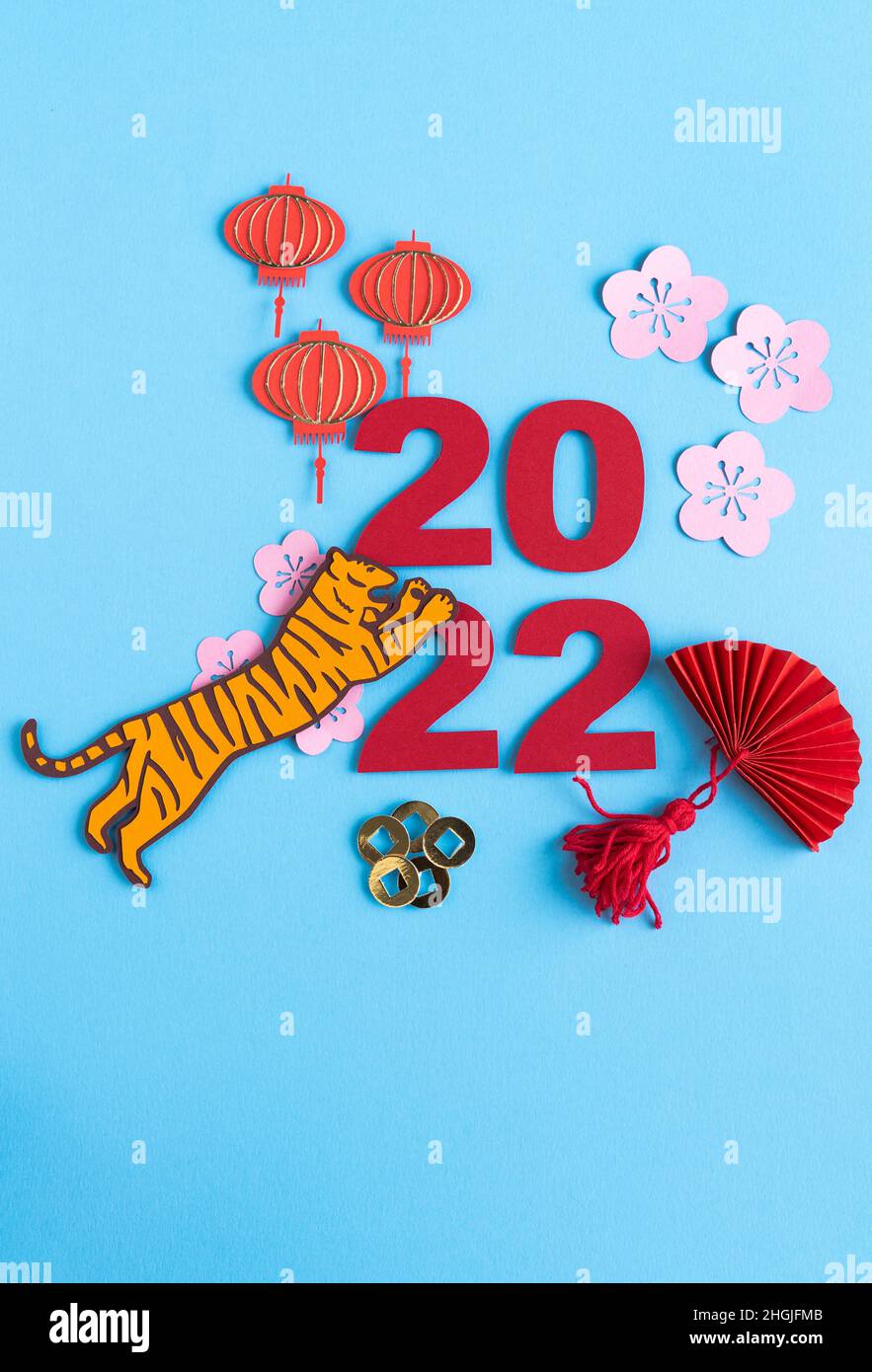 Chinese New Year, year of the tiger. Paper decoration with traditional motifs and tiger on blue background. Copy space. Stock Photo