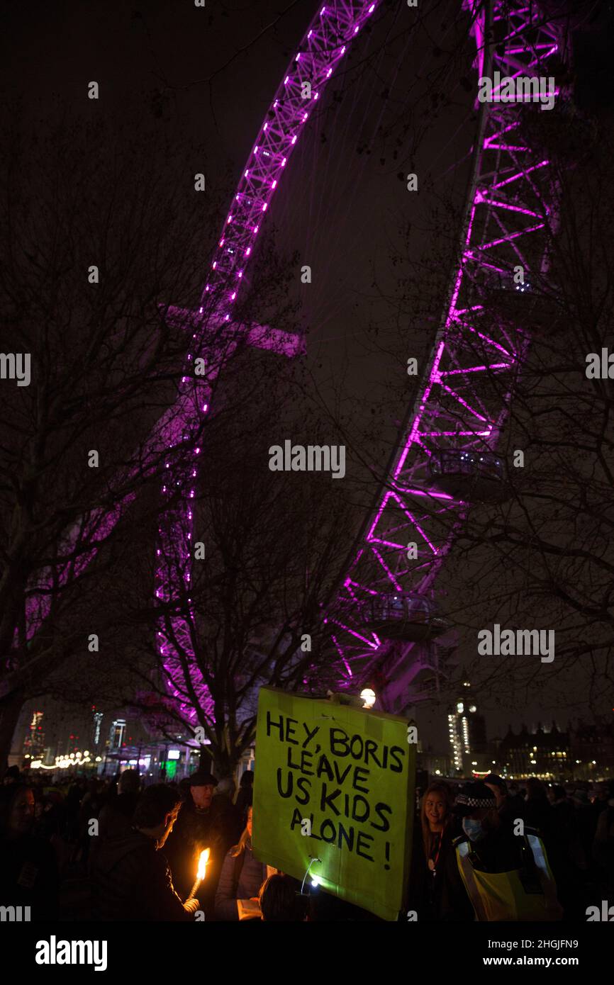 A placard is held as participants gather for a freedom rally against Covid-related measures such as vaccine passports near London Eye in London. Stock Photo