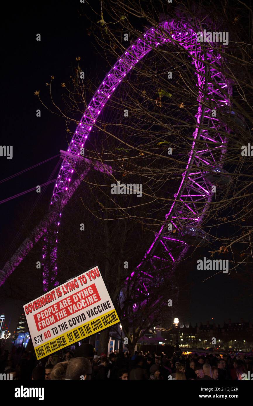 A placard is held as participants gather for a freedom rally against Covid-related measures such as vaccine passports near London Eye in London. Stock Photo