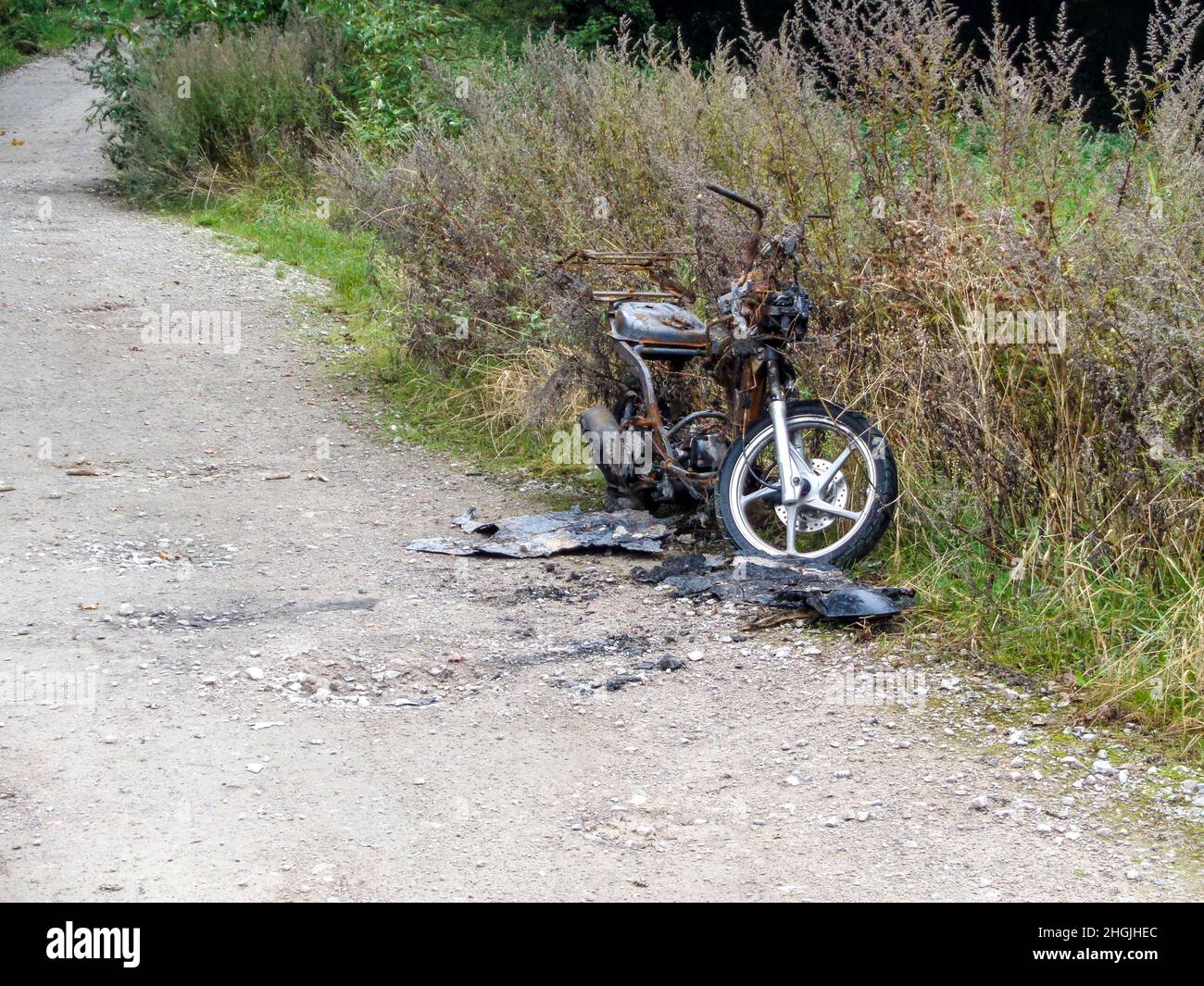 Stolen, burned out and abandoned motorcycle in the countryside Stock ...