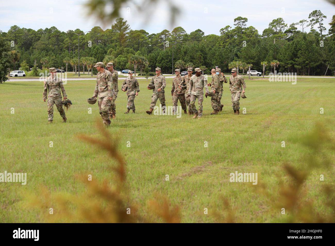 Candidates of the Expert Infantry Badge and Expert Soldier Badge assigned to the 3rd Infantry Division walk to the 2nd Armored Brigade Combat Team's headquarters after finishing hot load training on helicopters before the award ceremony at Fort Stewart, Georgia, Aug. 20, 2021. Candidates completed four days of intense testing in both rough weather conditions and a COVID-19 mitigation environment followed by a road march and a final tactical task on day five after two weeks of train-up to obtain the coveted badges. Stock Photo