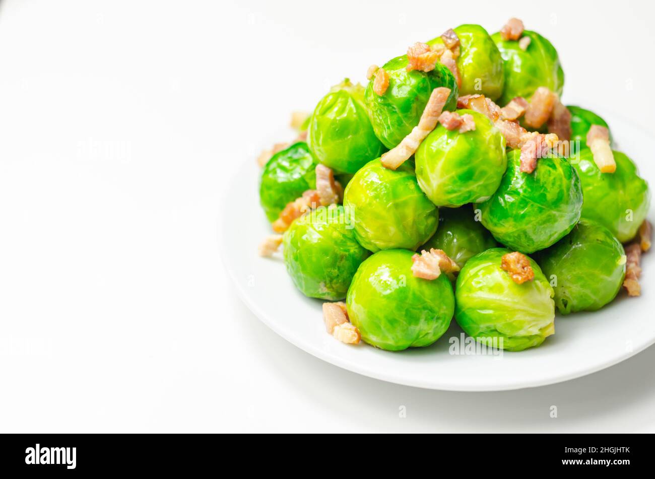 Tasty brussels sprouts with smoked bacon lardons and salted butter