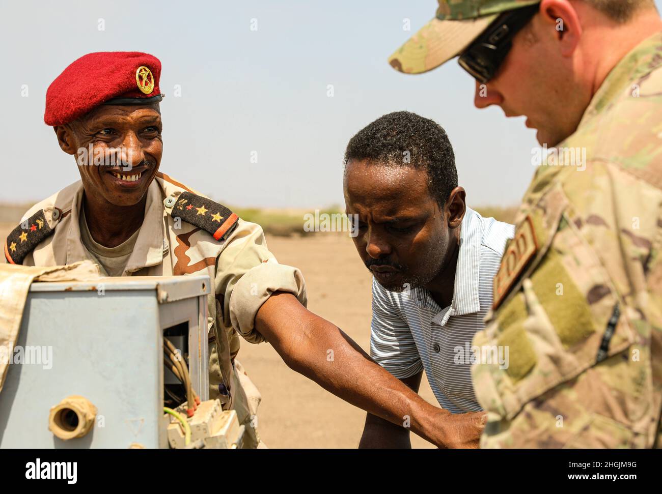 Capt. Le Mohamed Louaita, commander for Djiboutian Demining Co. expresses gratitude to Tech. Sgt. Dylan Wagner, explosive ordnance disposal technician, 123rd Airlift Wing during verbal exchange on August 22, 2021 in Djibouti City, Djibouti.Kentucky National Guard Engineers with the 577th Sapper Company and 123rd Airlift Wing, traveled more than 15,000 miles to Camp Lemonier, Djibouti to conduct training with the Djiboutian military de-mining company as a part of the State Partnership Program (SPP) August 19 – 29, 2021. Stock Photo