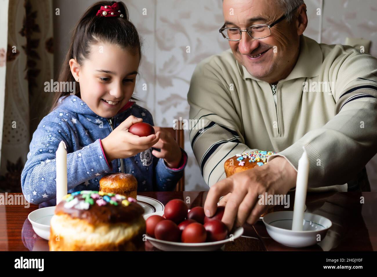 Young girl grandfather in traditional hires stock photography and