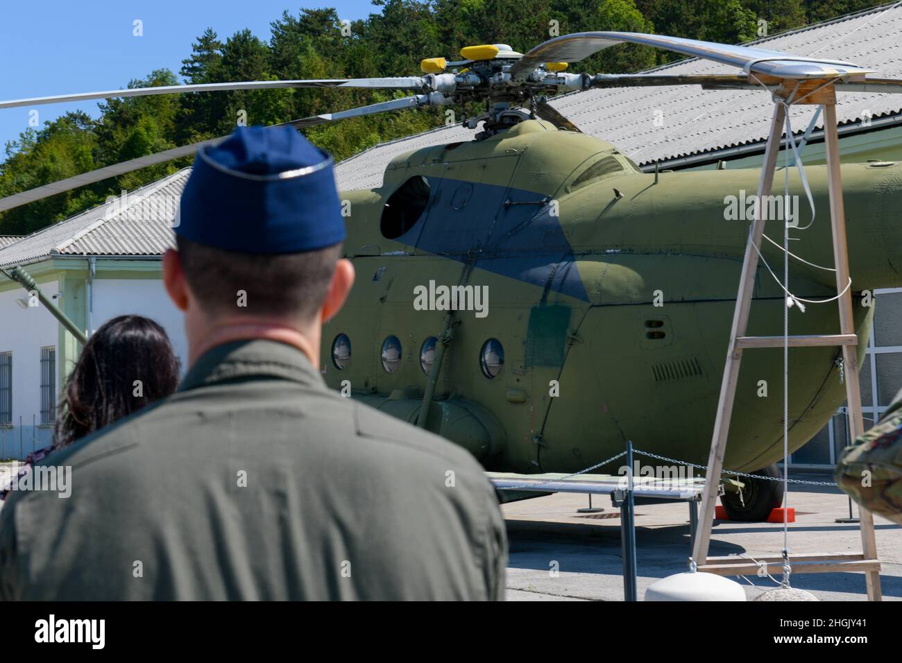 U.S. Air Force Lt. Col. Branden Felker, 31st Operational Support Squadron director of operations, looks at a helicopter at the Pivka Park of Military History in Pivka, Slovenia, Aug. 25, 2021. The museum is operated by the town of Pivka and the Slovenian Armed Forces and the exhibits illustrate history from World War II to the Cold War, the time frame of the former Socialist Federal Republic of Yugoslavia. Stock Photo