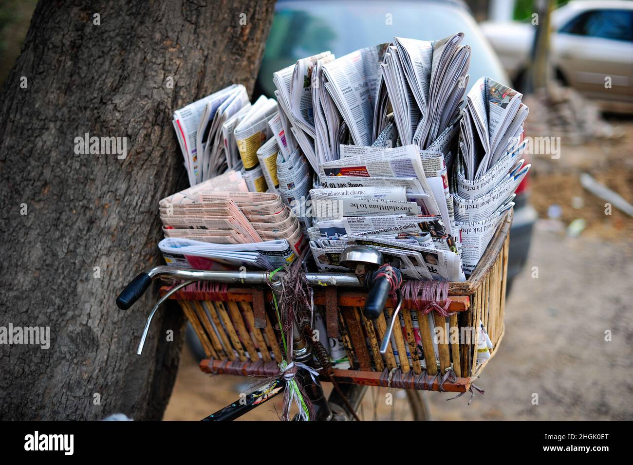Newspapers for sale in a basket on a bike in Delhi, India, Asia. Stock Photo