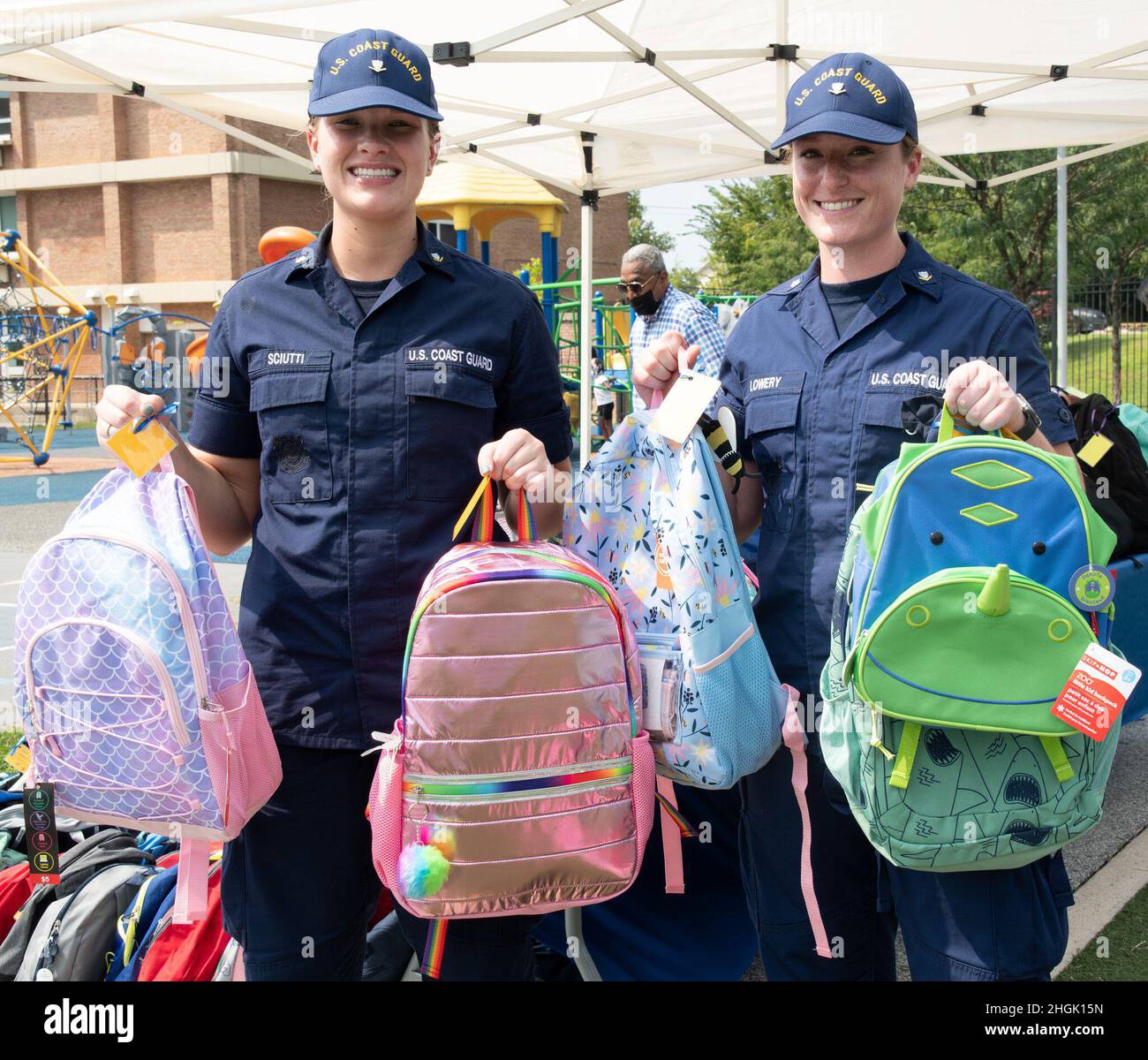 Petty Officers 3rd Class Devin Sciutti (left) and Summer Lowery hold up just a few of the 289 backpacks filled with supplies that were handed out to students at Anita J. Turner Elementary School during a back-to-school night event on Thursday, August 26th. USCG’s annual St. Elizabeth’s Back-to-School backpack and supply drive provides D.C. community students with gear and equipment to prepare for the new school year. This year, the annual drive was part of the Coast Guard's Partnership in Education Program. Stock Photo