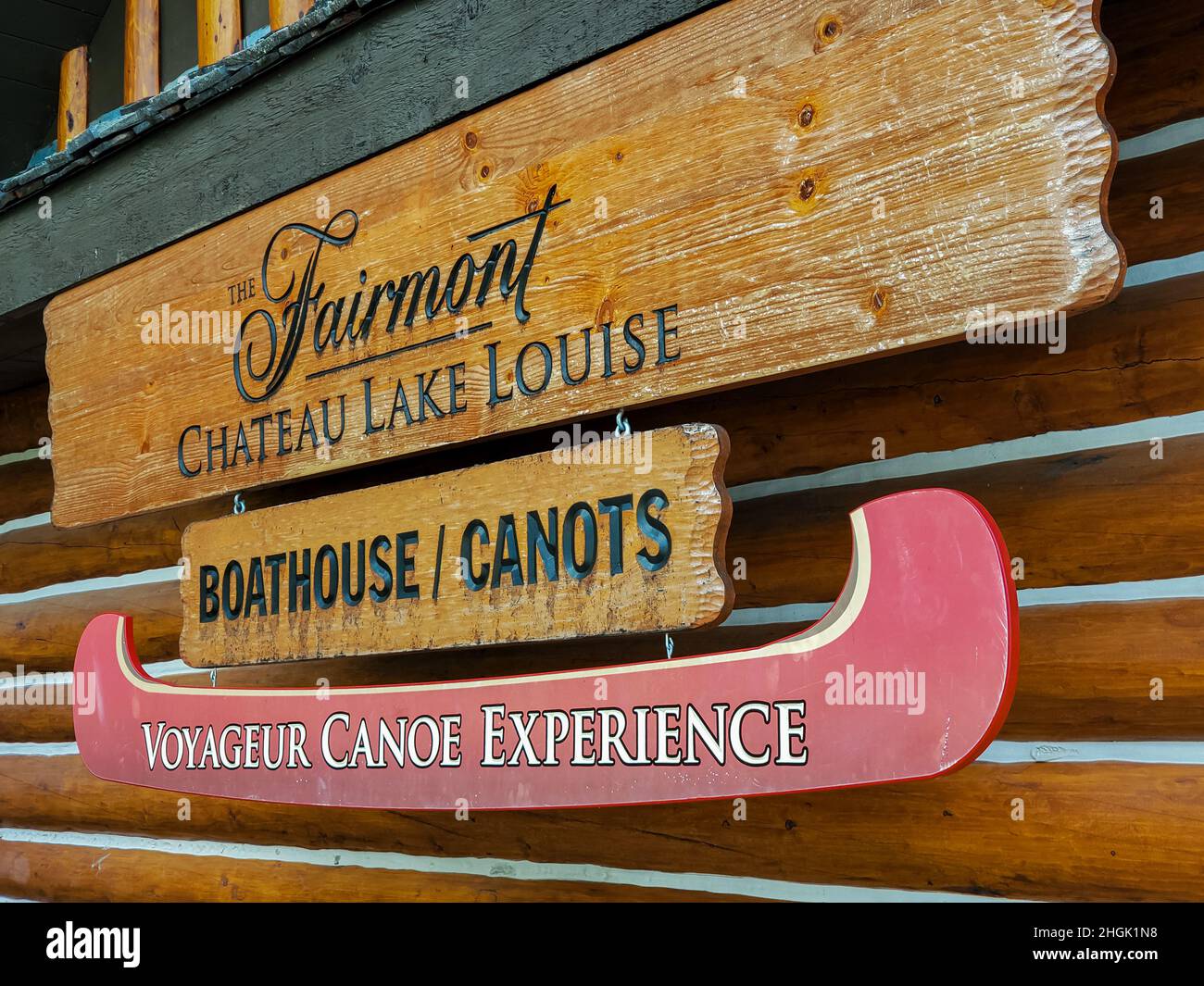 Boathouse and red canoes wooden board sign, Banff National Park, Canada Stock Photo