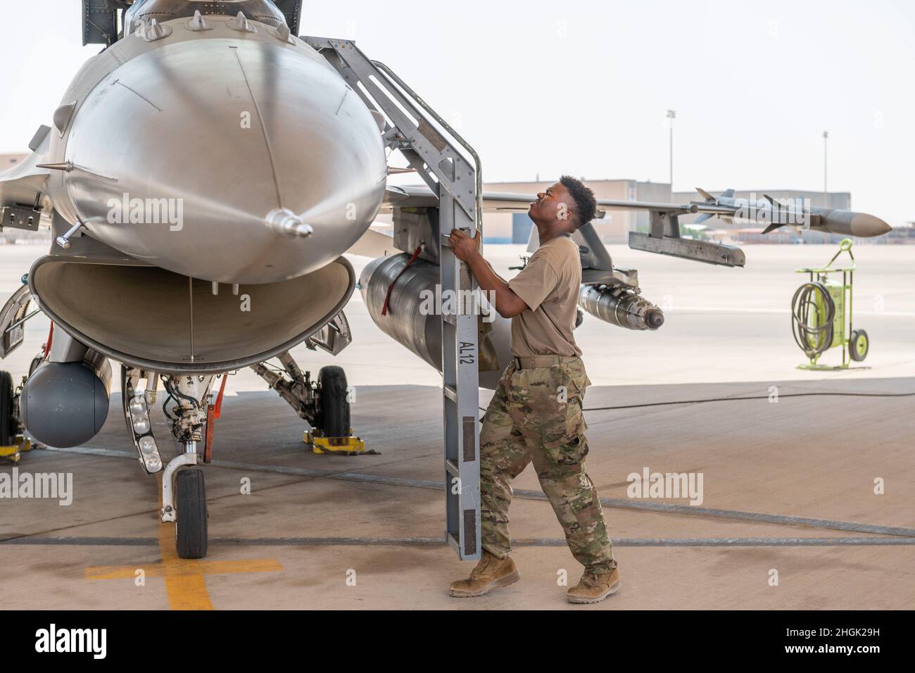 A U.S. Air Force crew chief with the 121st Expeditionary Fighter Generation Squadron conducts a pre-launch inspection on an F-16 Fighting Falcon at Prince Sultan Air Base, Kingdom of Saudi Arabia, Aug. 27, 2021. In addition to logistics and manpower support, the 378th Air Expeditionary Wing provided combat airpower to ensure air superiority for U.S. Central Command during noncombatant evacuation operations in Afghanistan. Stock Photo