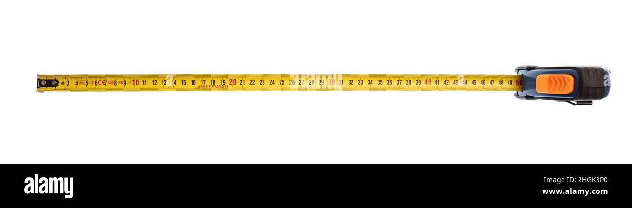 Measure tape isolated cut out on white background, overhead view. Yellow color metal meter fifty centimeter long Stock Photo
